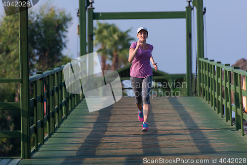 Image of sporty woman jogging