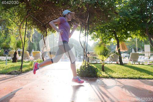 Image of sporty woman jogging