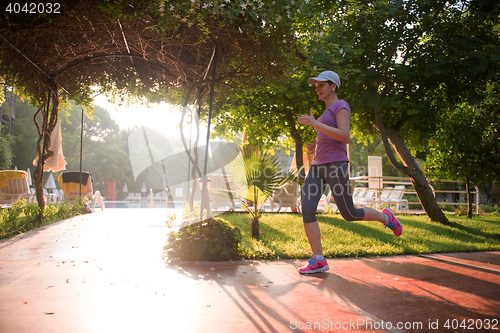 Image of sporty woman jogging