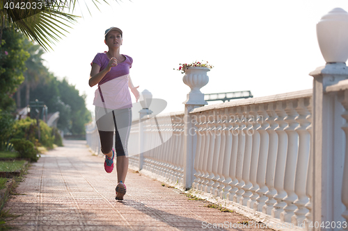 Image of sporty woman jogging