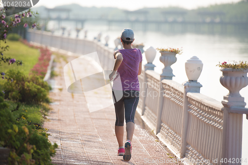 Image of sporty woman jogging