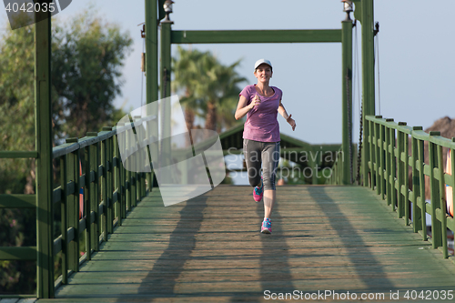 Image of sporty woman jogging