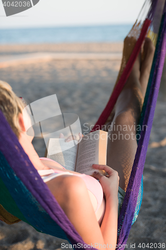 Image of relaxed woman laying in hammock