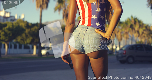 Image of Rear View of Woman Wearing Sexy Denim Shorts