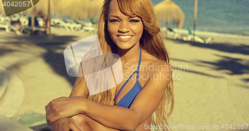 Image of African Girl in Bikini Resting at Beach Bench