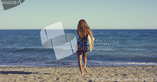 Image of Sexy Woman with Surfing Board Walking at the Beach