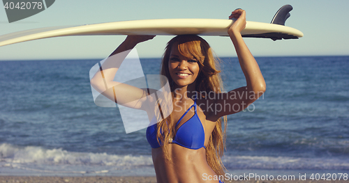 Image of Sexy African Woman Holding Surfing Board Overhead