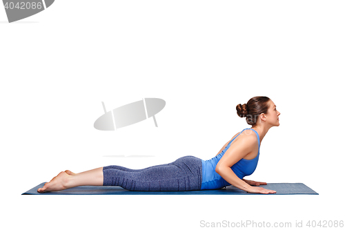 Image of Sporty fit yogini woman practices yoga asana bhujangasana 