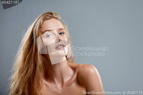 Image of Closeup of sensual woman looking at camera