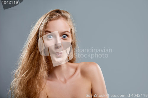 Image of Closeup of woman playfully making funny face