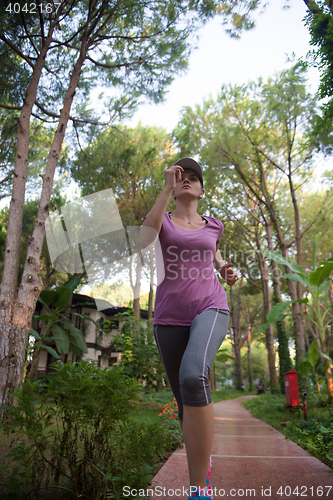 Image of sporty woman jogging