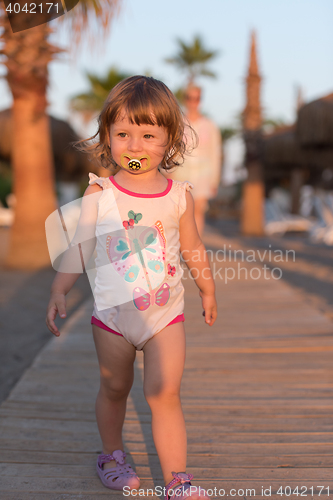 Image of girl and mother walking