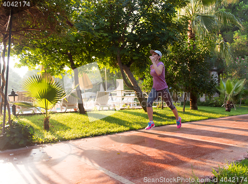 Image of sporty woman jogging