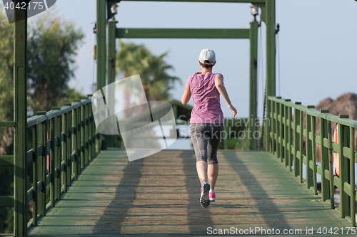 Image of sporty woman jogging