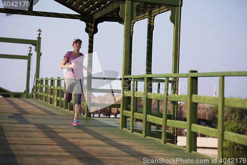 Image of sporty woman jogging