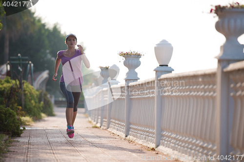 Image of sporty woman jogging