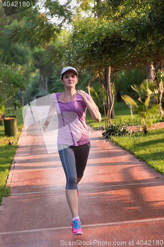 Image of sporty woman jogging
