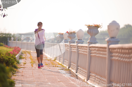 Image of sporty woman jogging