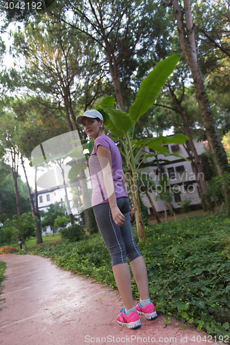 Image of sporty woman jogging