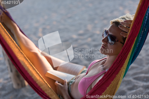 Image of relaxed woman laying in hammock