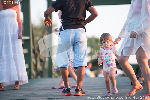 Image of girl and mother walking