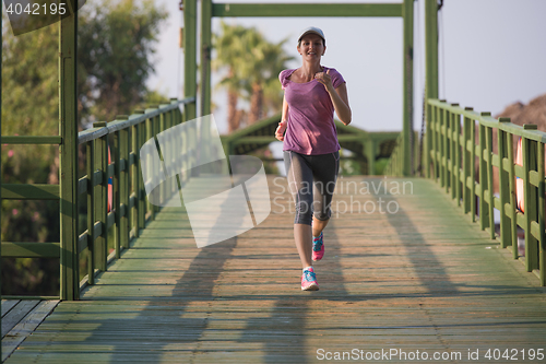 Image of sporty woman jogging