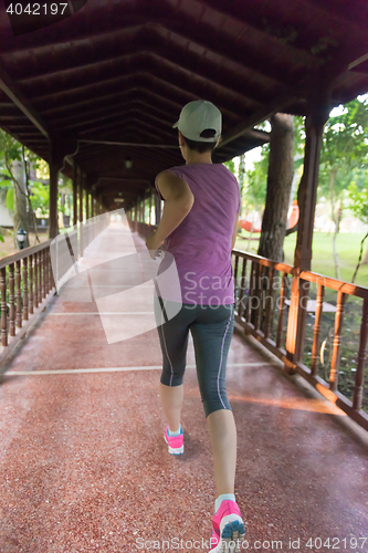 Image of sporty woman jogging