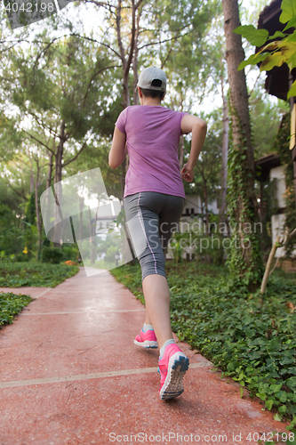 Image of sporty woman jogging