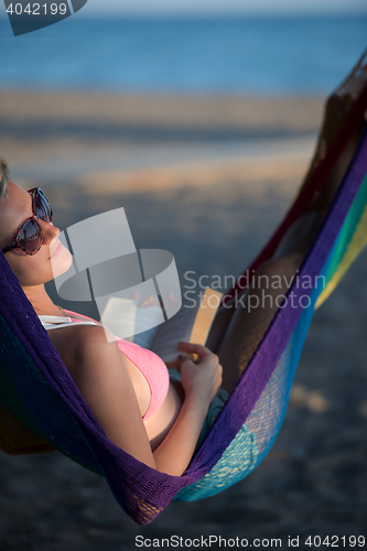 Image of relaxed woman laying in hammock