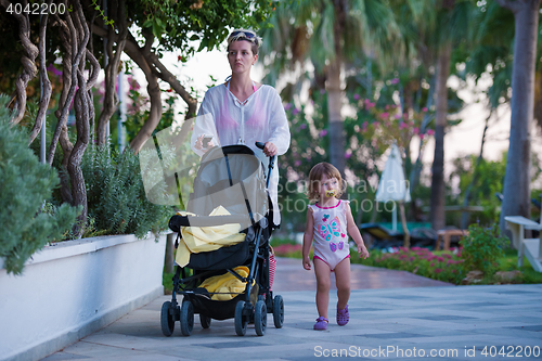 Image of girl and mother walking