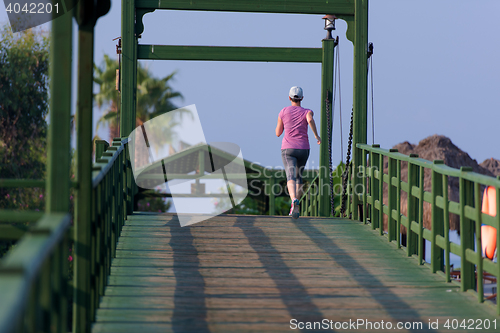 Image of sporty woman jogging