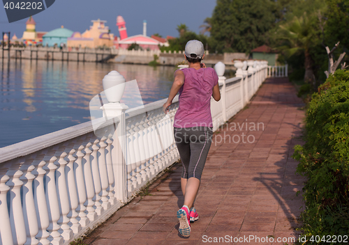 Image of sporty woman jogging