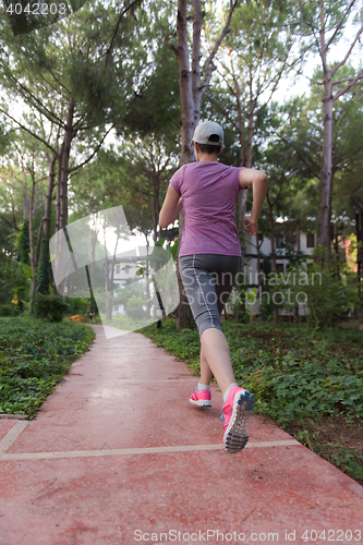 Image of sporty woman jogging