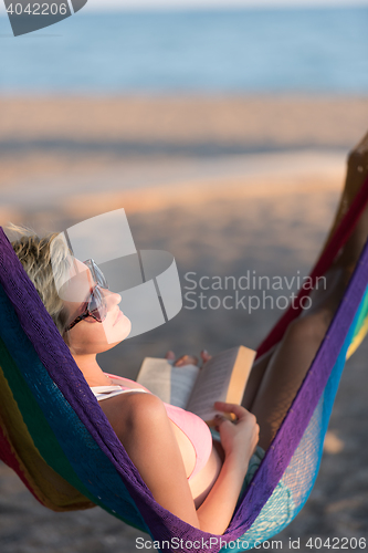 Image of relaxed woman laying in hammock