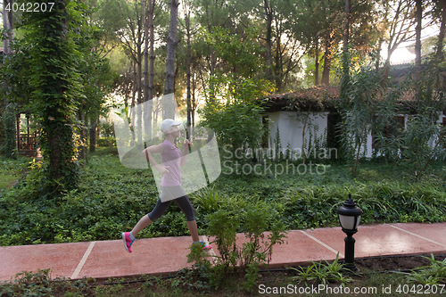 Image of sporty woman jogging