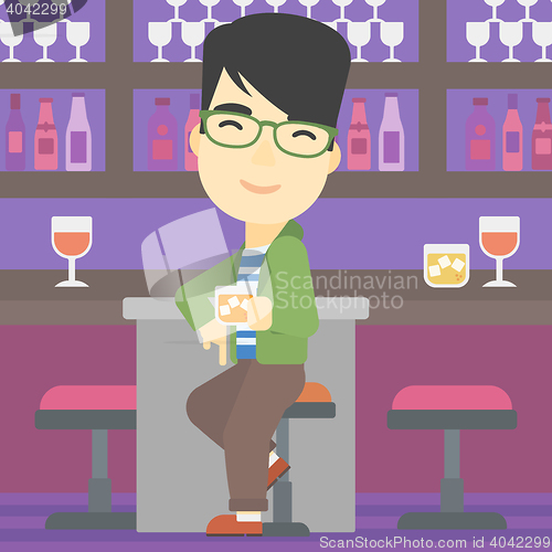 Image of Man sitting at the bar counter.