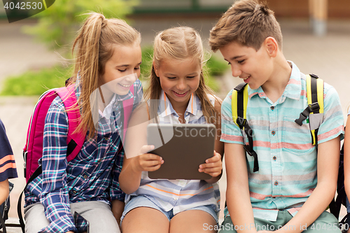 Image of group of happy elementary school students talking