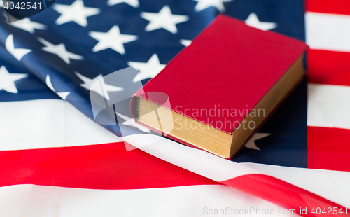 Image of close up of american flag and book
