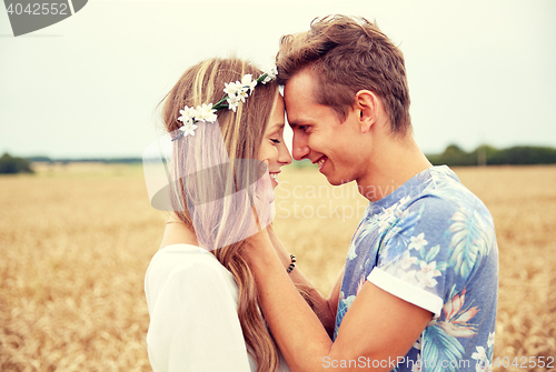 Image of happy smiling young hippie couple outdoors