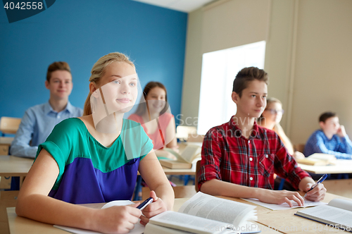 Image of group of students with books at school lesson