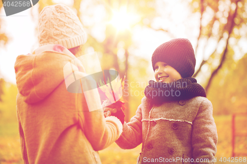 Image of smiling children in autumn park