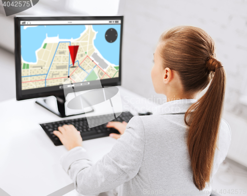 Image of businesswoman with gps navigator map on computer