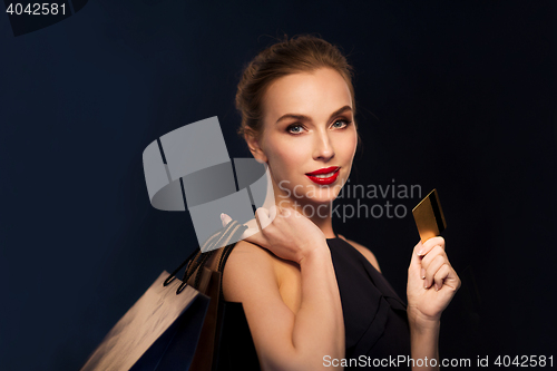 Image of woman with credit card and shopping bags