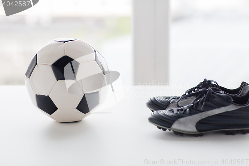 Image of close up of soccer ball and football boots