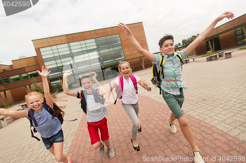 Image of group of happy elementary school students running