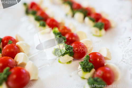 Image of close up of mozzarella and cherry tomato canape