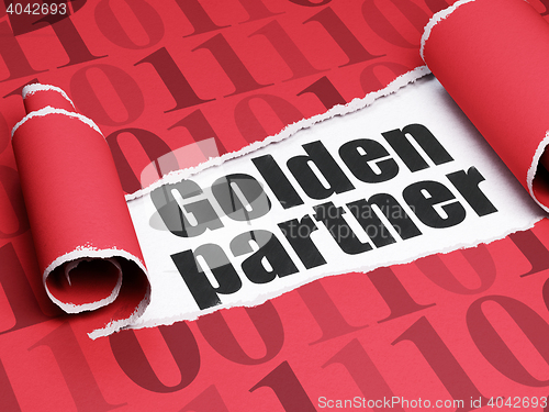 Image of Finance concept: black text Golden Partner under the piece of  torn paper