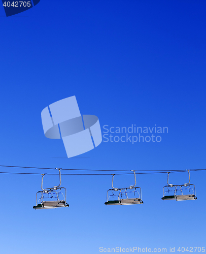 Image of Ski-lift and blue clear sky
