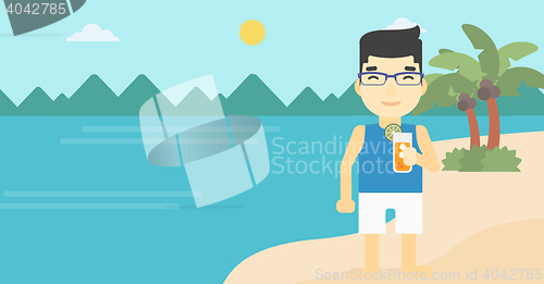 Image of Man with cocktail on the beach.