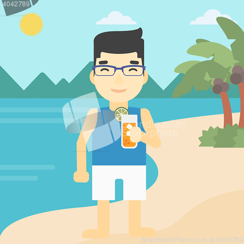 Image of Man with cocktail on the beach.